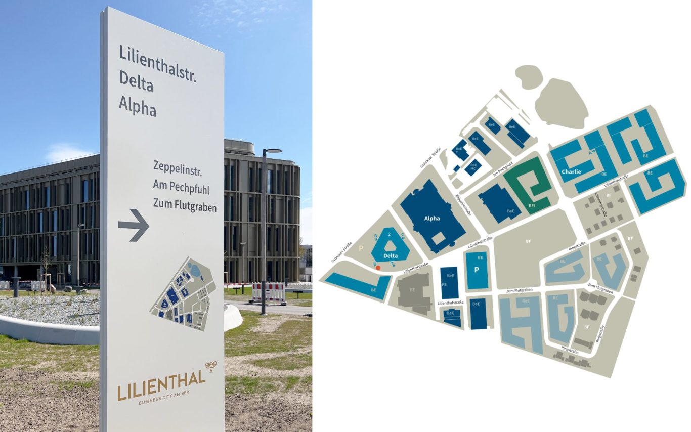 Außenübersichten mit Lageplan Bürohaus Schönefeld Stele Wegweiser zum Bürohaus mit einer Karte des Geländes